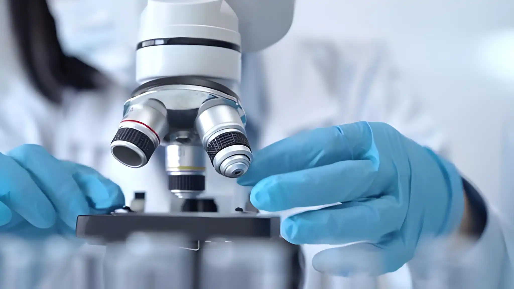 Home Researcher using a microscope in a laboratory setting for peptide purity verification and scientific study - Pureptid Wellness